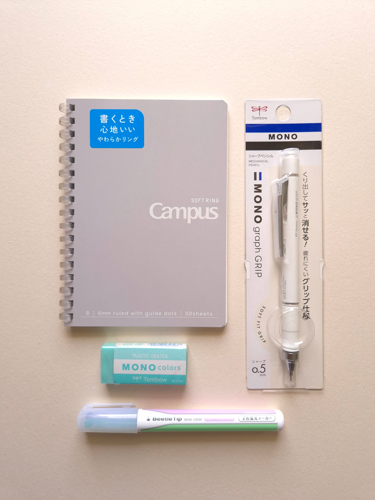 Softly Written Mist gift set with grey notebook, ivory mechanical pencil, green eraser and dual colour highlighter
