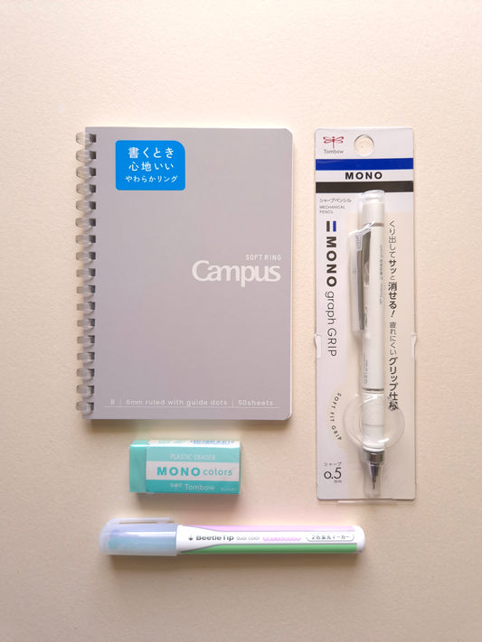 Softly Written Mist gift set with grey notebook, ivory mechanical pencil, green eraser and dual colour highlighter