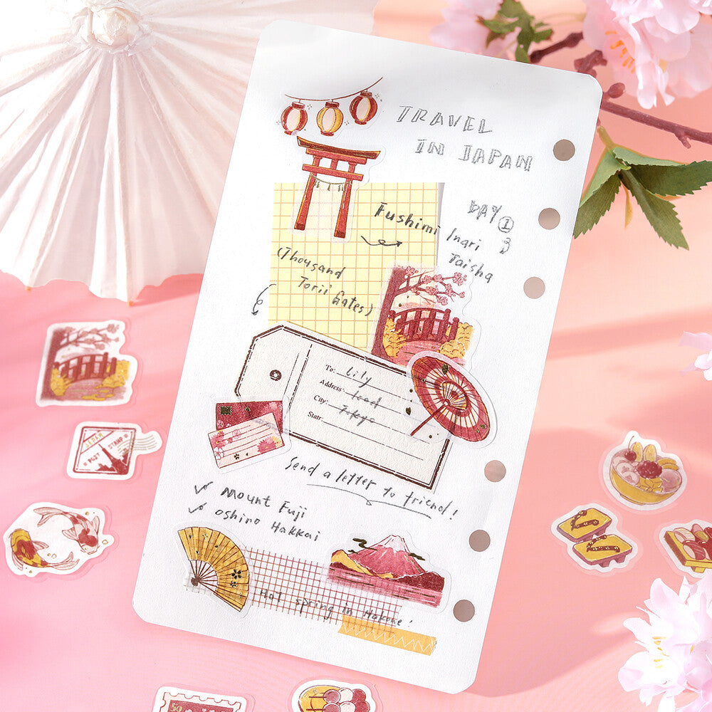 BGM To Japan flake stickers used on a travel journal page with torii gate, Mount Fuji and traditional Japanese motifs