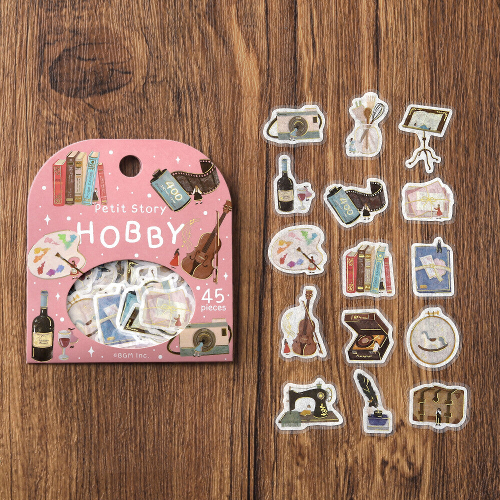 BGM Petit Story Hobby flake sticker set showing 15 hobby-themed designs beside the pink package