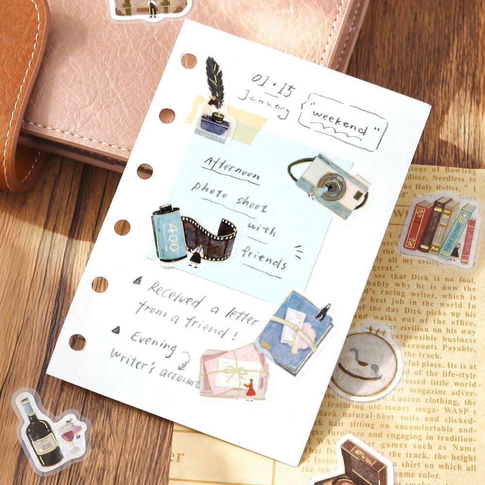BGM Petit Story Hobby flake stickers decorating a journal page with photography and letter-writing motifs