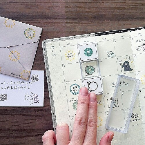 Kutsuwa Hankoslide Cat in a Bag layered stamp alignment in a monthly planner