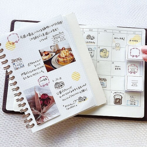 Kutsuwa Hankoslide Cat in a Bag used in a planner and journal
