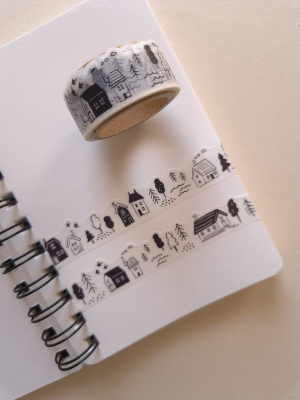 Mind Wave Black & White Lifestyle die-cut masking tape shown at an angle with monochrome houses and trees