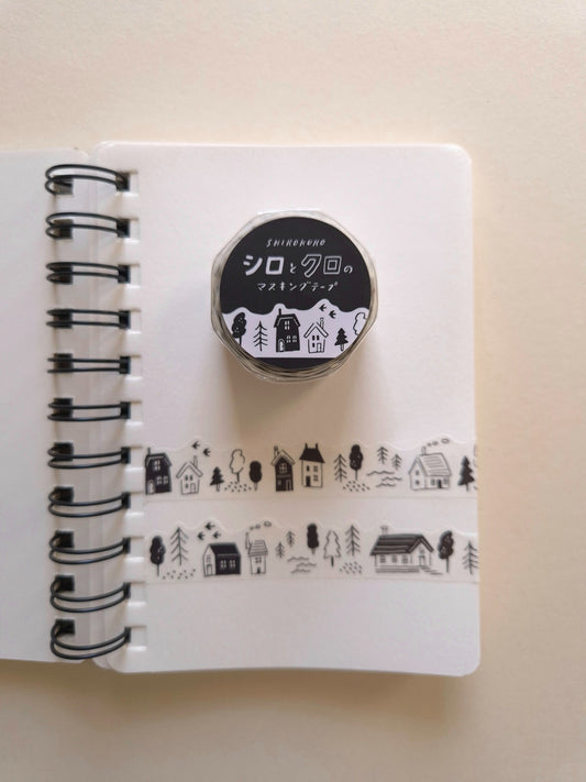Mind Wave Black & White Lifestyle die-cut masking tape roll displayed with two sample strips on a white notebook