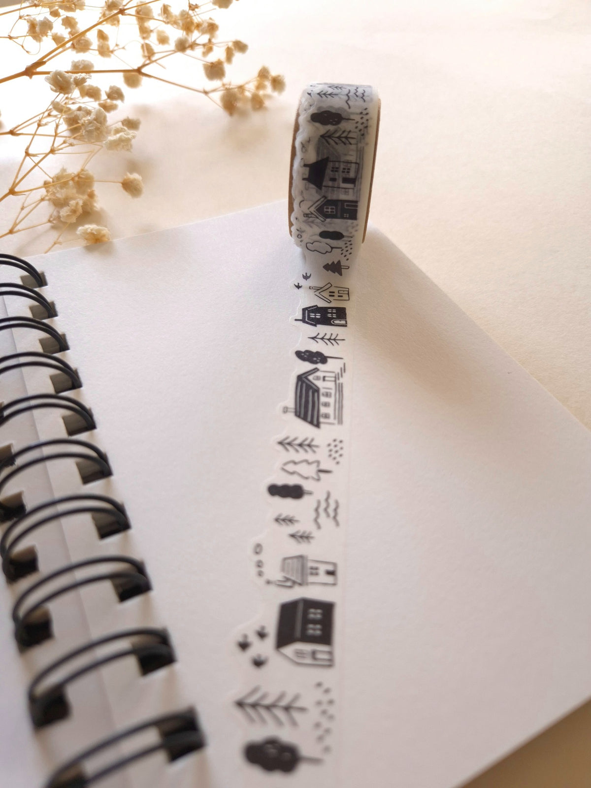 Mind Wave Black & White Lifestyle die-cut masking tape unrolled across a notebook page