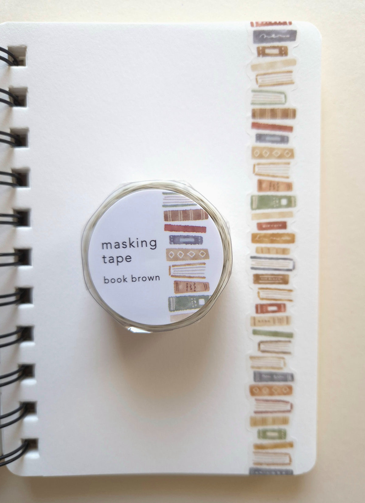 Mind Wave Book Brown die-cut masking tape on a spiral notebook with book-pattern tape sample