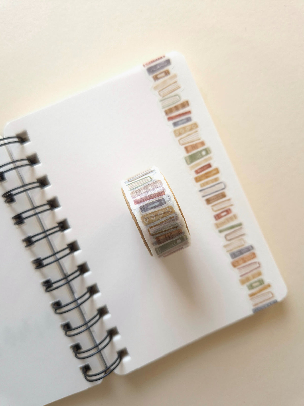 Mind Wave Book Brown die-cut masking tape roll on a spiral notebook showing the book design