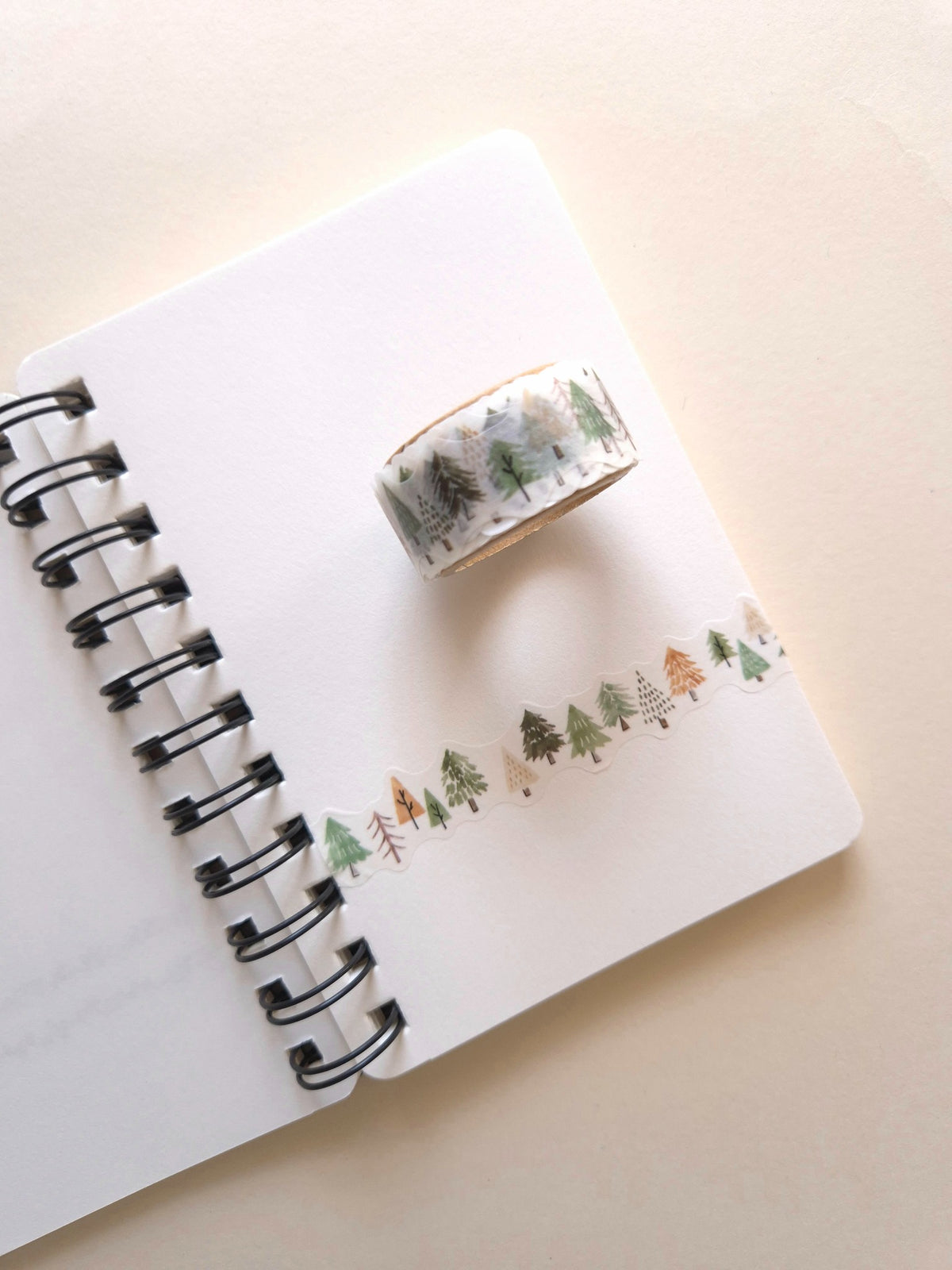 Mind Wave COZY Die-Cut Masking Tape – Forest roll with die-cut tree border on a notebook