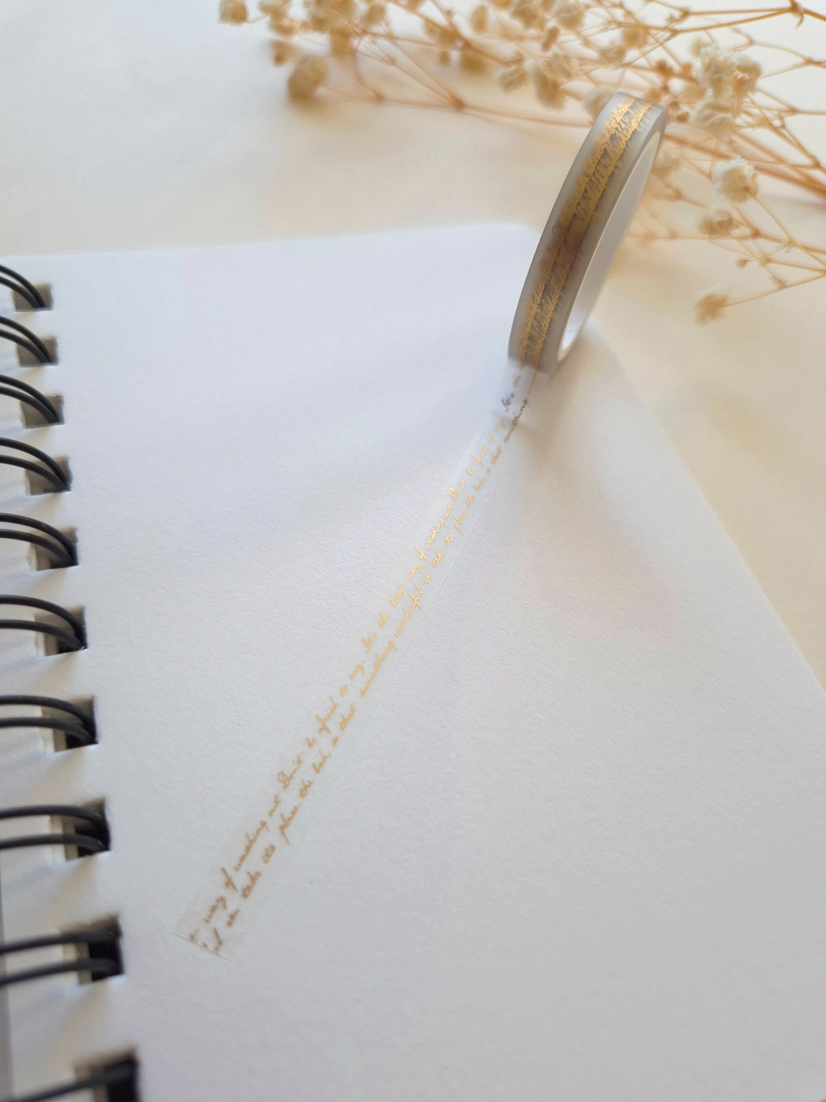 Mind Wave Foil-Stamped Clear Tape Lettering 7mm unrolled across a notebook showing delicate gold lettering