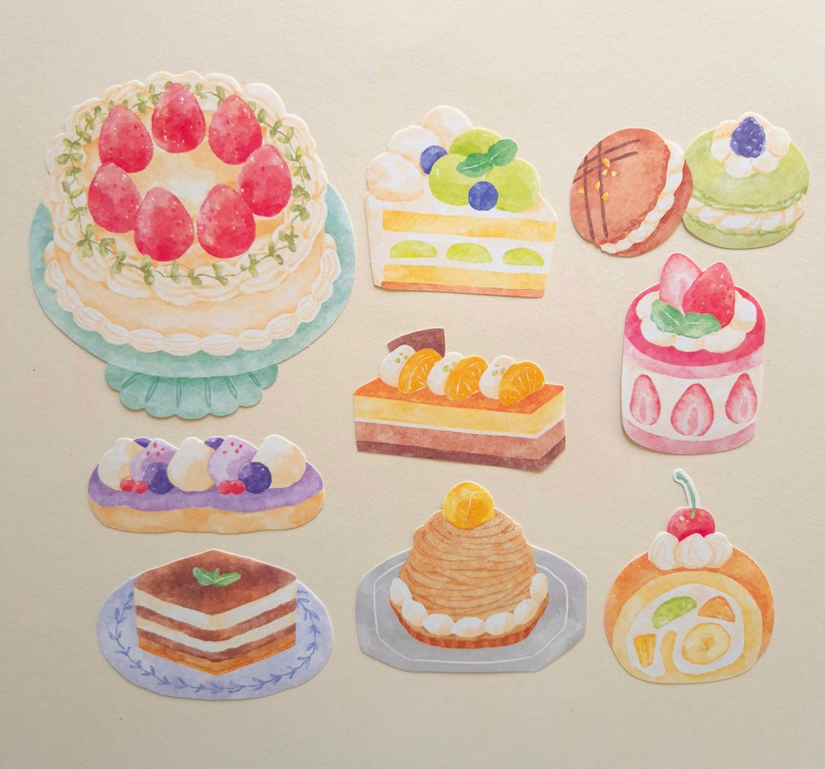 Mind Wave Grand Jour Cake flake stickers arranged to show the 9 large cake and dessert designs