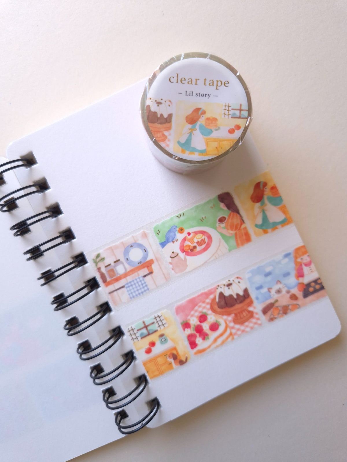 Mind Wave Lil Story Baking Scene clear tape roll displayed above baking and dessert illustrations on a notebook page