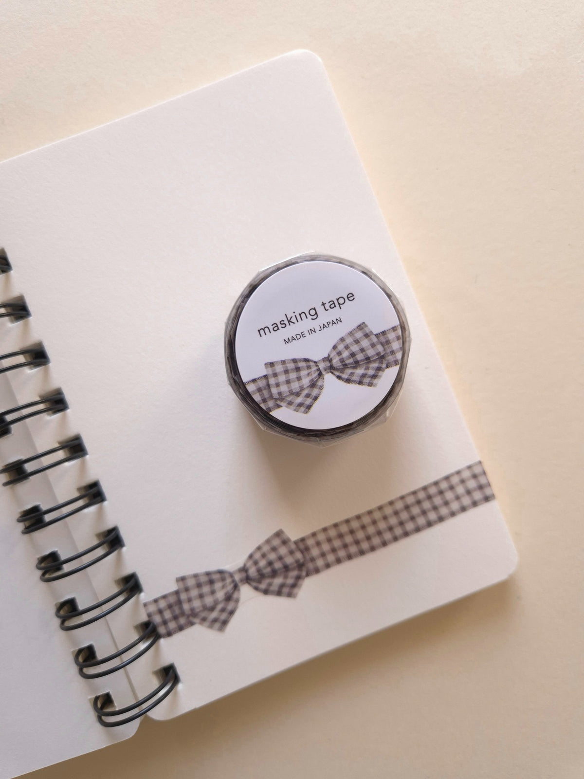 Mind Wave Ribbon Die-Cut Masking Tape Gingham Check Gray with bow design applied to notebook