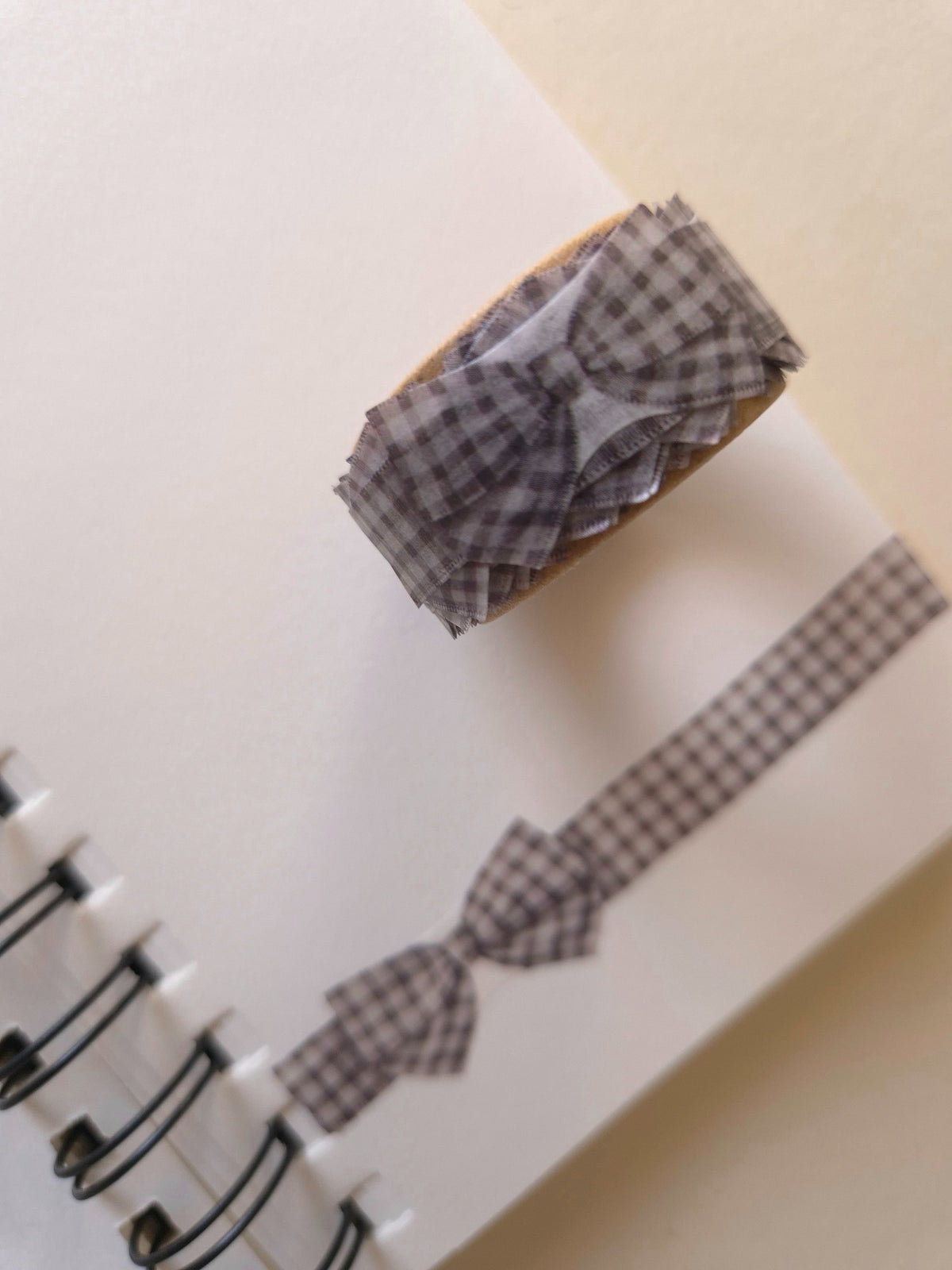 Close-up of Mind Wave Gingham Check Gray ribbon die-cut masking tape roll and bow motifs