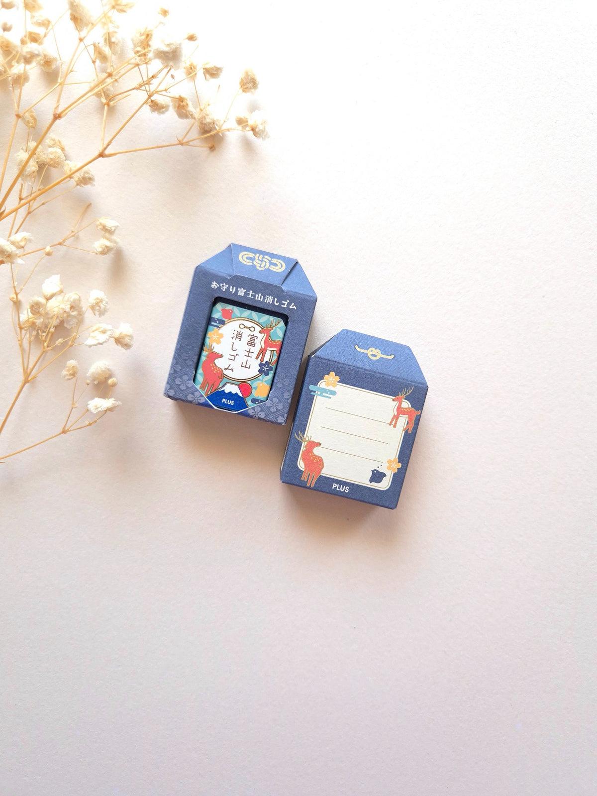 PLUS AIR-IN Mt. Fuji Eraser Deer Dark Blue, front and back packaging photographed on cream background