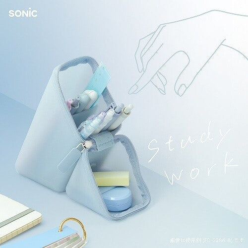 Sonic Kakusta Sheer Silicone Portable Pen Holder in Blue used as a standing desk organiser